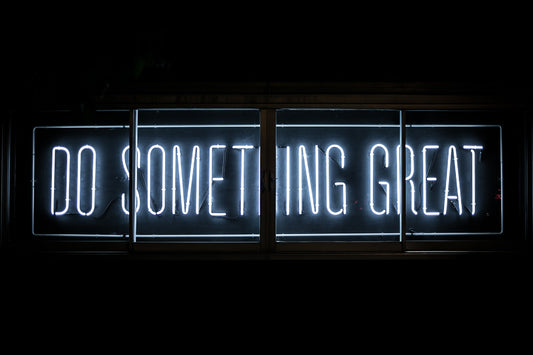 Neon sign that says "Do Something Great"